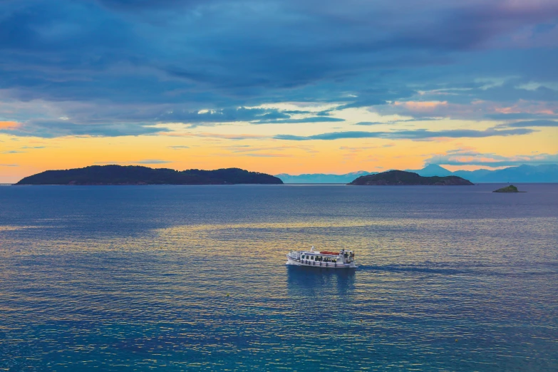 a small boat out on a large body of water