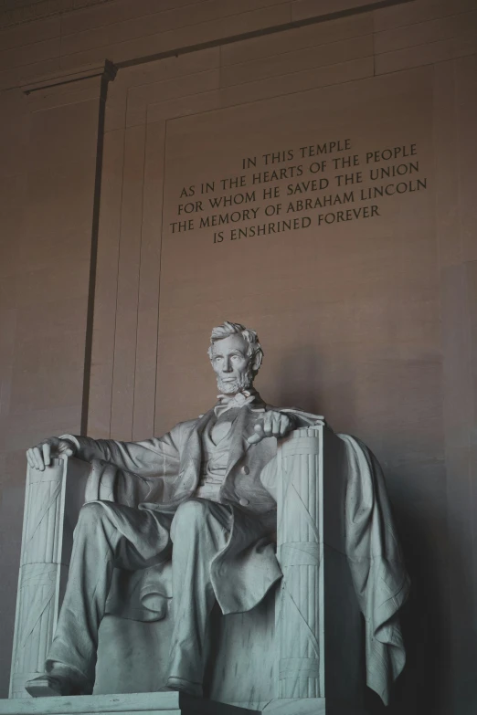 there is a statue of aham lincoln in the lincoln memorial