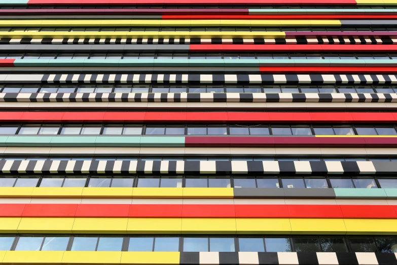 a very tall colorful building with lots of windows