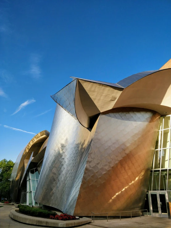 the exterior of an old building with metal wavy architecture