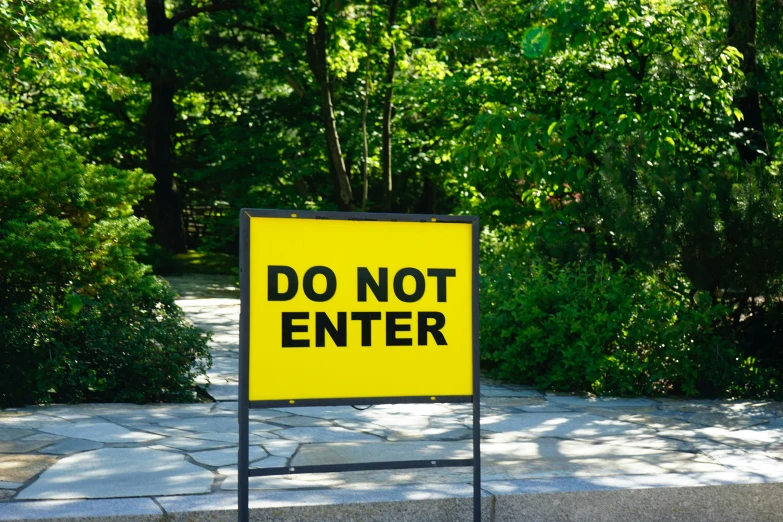 a do not enter sign near some bushes