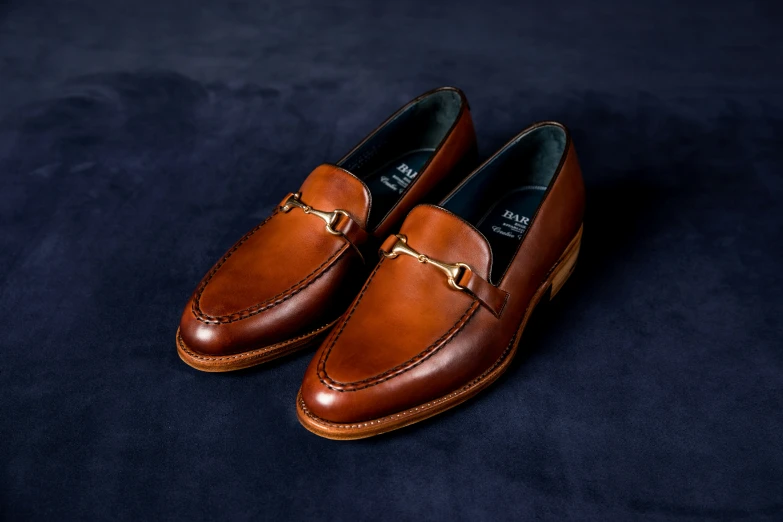 the tan loafer with a gold chain