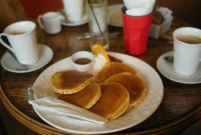 pancakes and coffee at a fancy breakfast on a wooden table