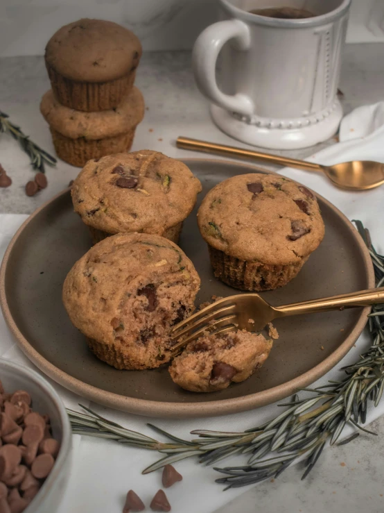 a plate with some muffins and coffee