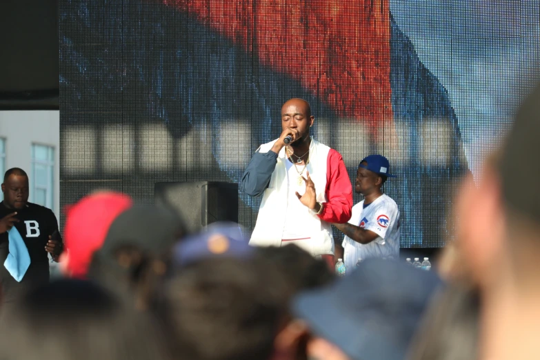 an african american male performing at the festival