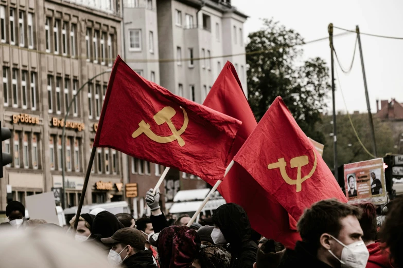 a group of people that are holding up flags