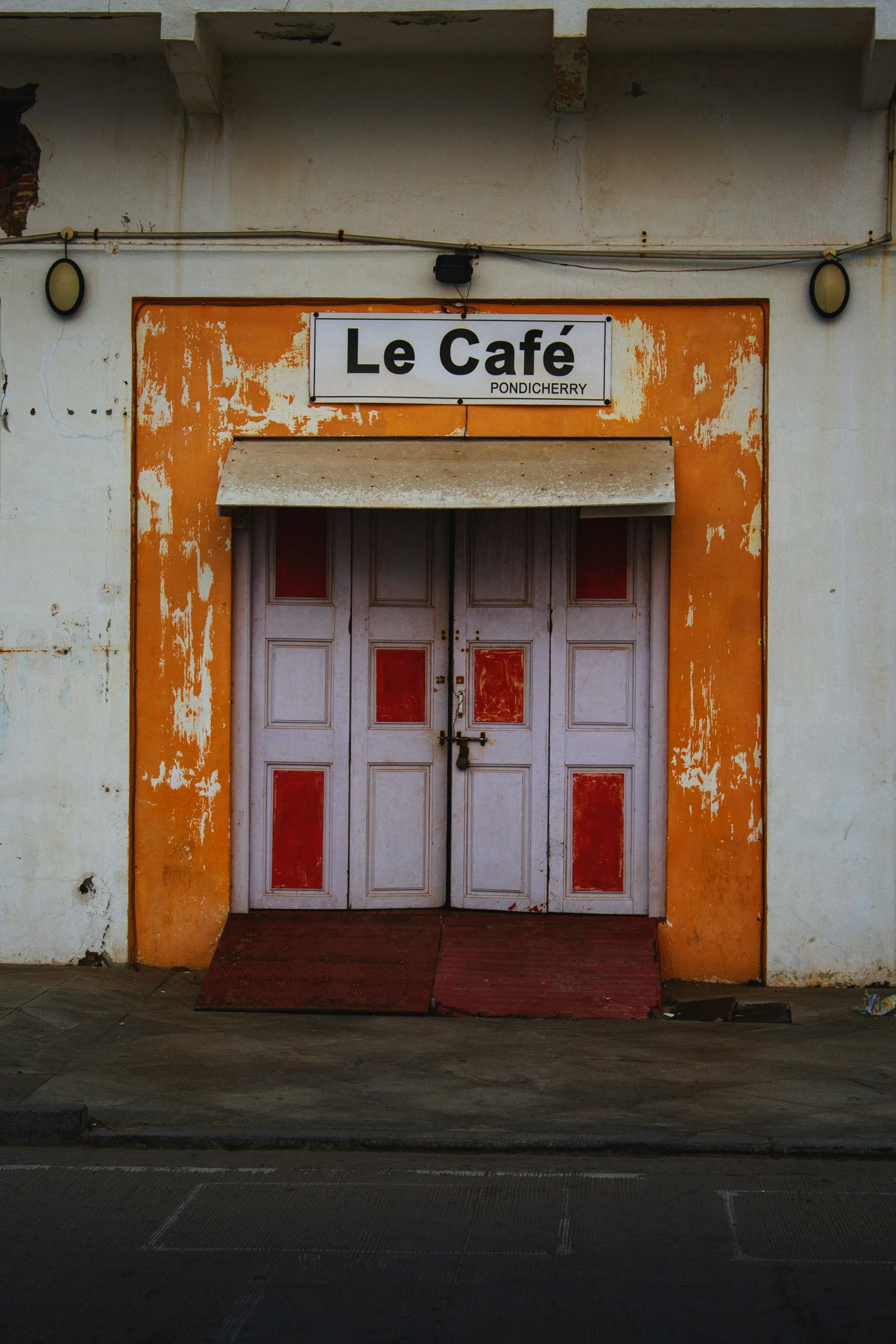 the front door of a restaurant where three doors are located