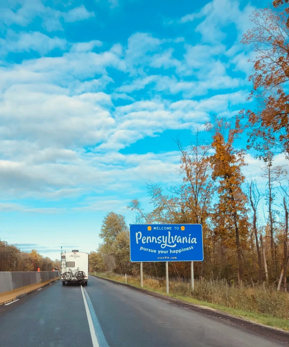 a highway sign sitting on the side of a road