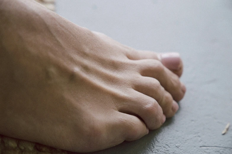 bare feet of a young person are visible closeup