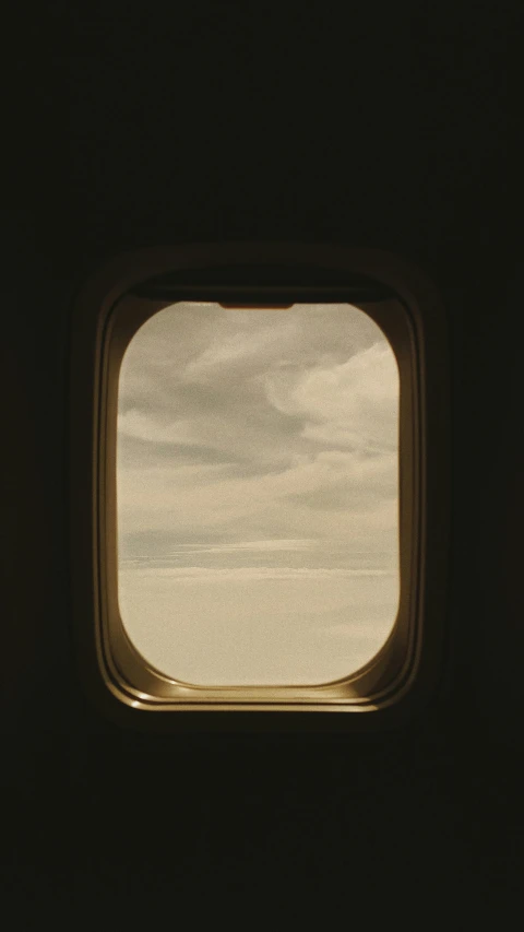 a window on an airplane looking at the water