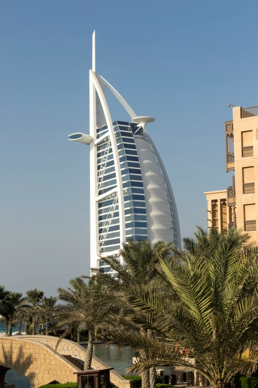 burjra tower rises above the city of dubai