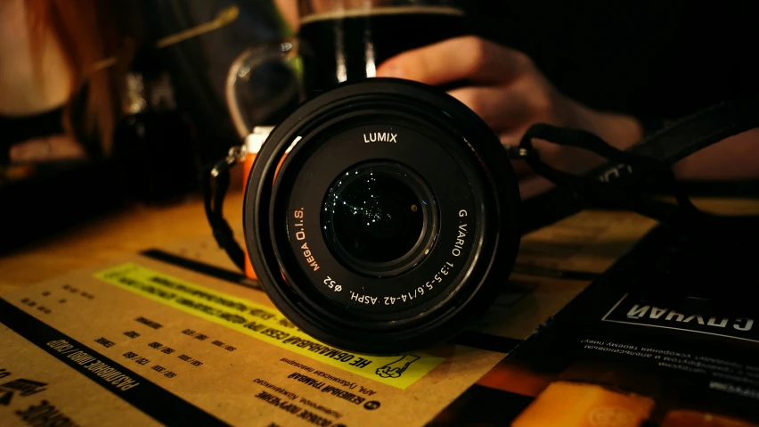 a camera and some drinks on a table