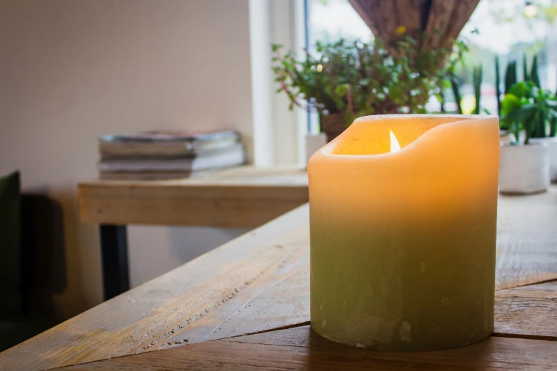 a small light in the middle of a wooden table