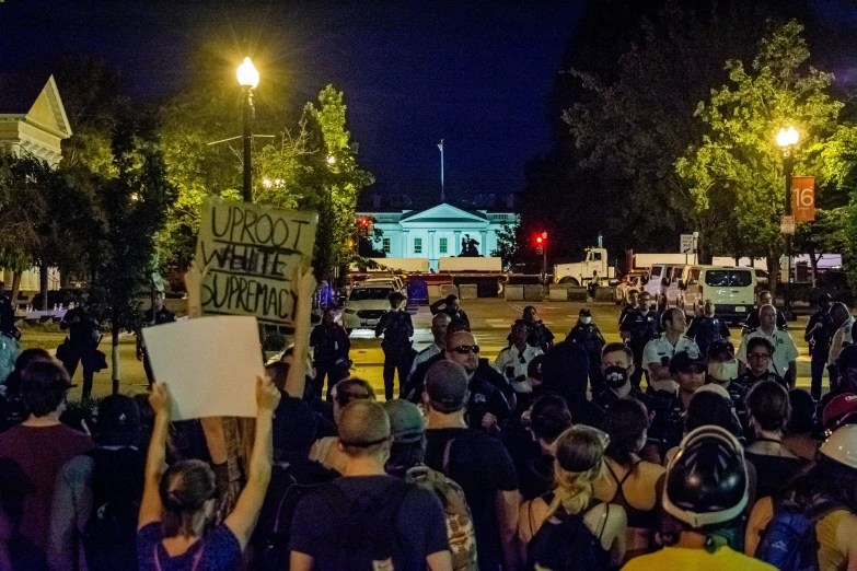 protestors march during a demonstration outside the capitol building