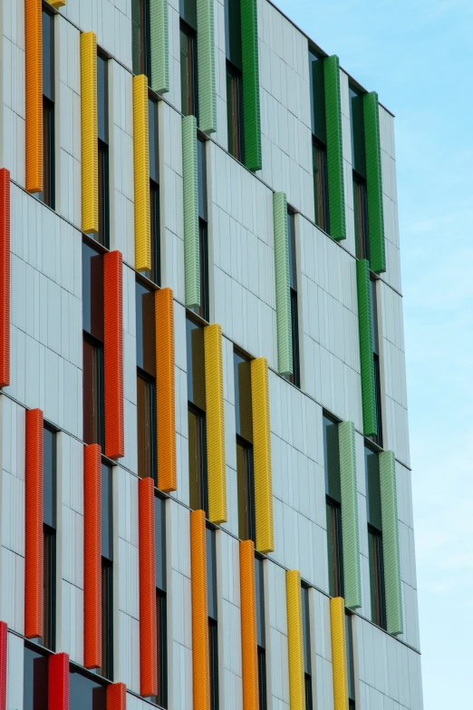 a very long building with some colorful colors on it