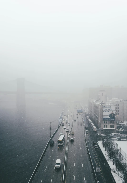 an overhead view of a road during a winter storm