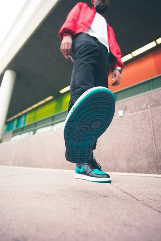 an older person wearing sneakers and walking