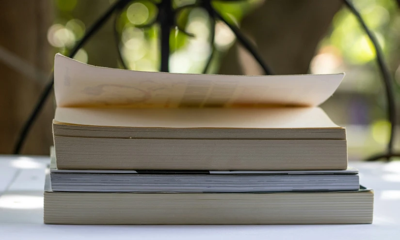 three books stacked on top of each other