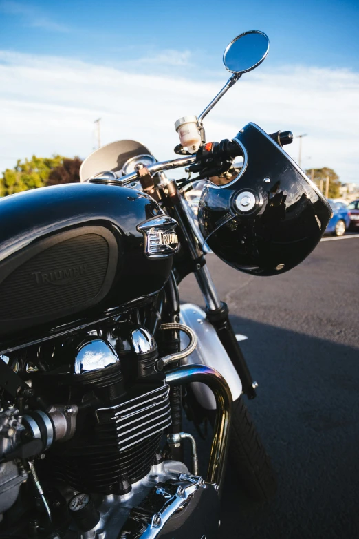 the motorcycle is parked on the street by himself