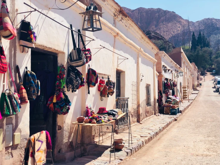 the shops lining the street in a town