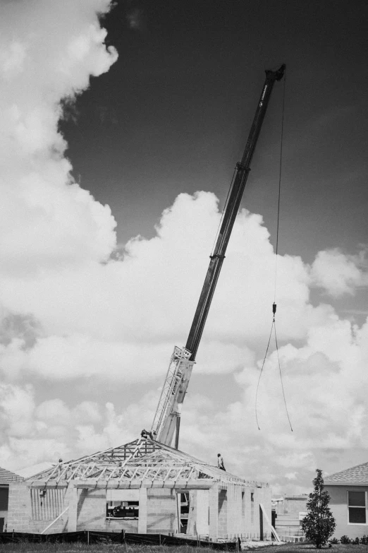 a large crane with a construction crane attached to it