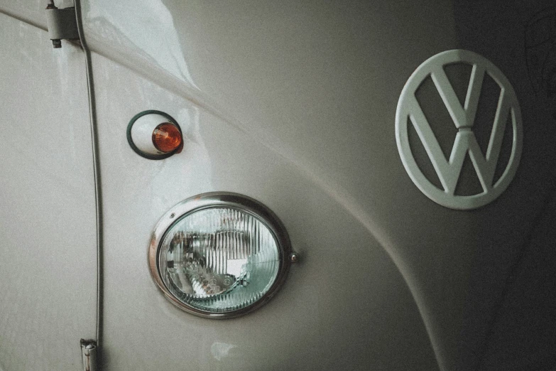 a white vw car with the volkswagen badge showing