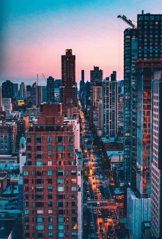 the city skyline of a large metropolitan area with high rise buildings, street lights, and traffic