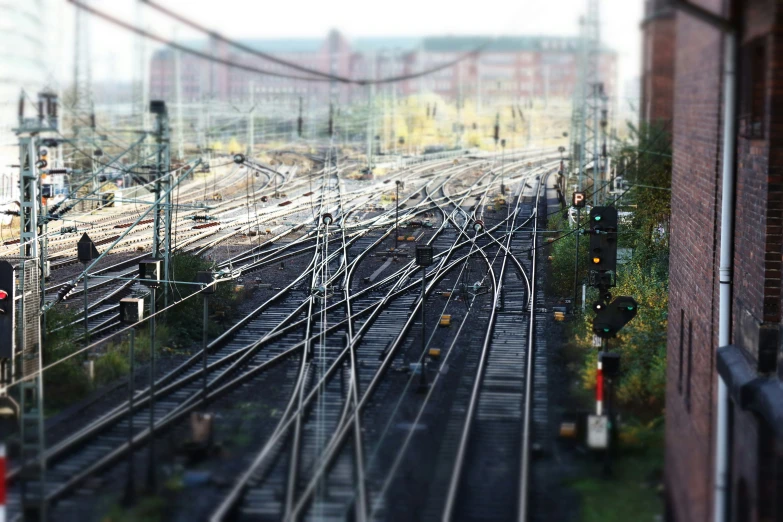 the aerial view of a train station with several sets of tracks