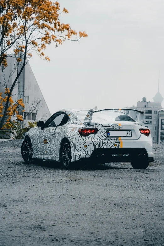 the new bmw z4 is parked in a parking lot