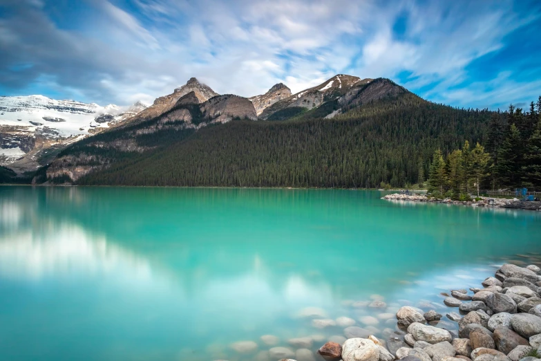 a scenic image with a mountain range in the background