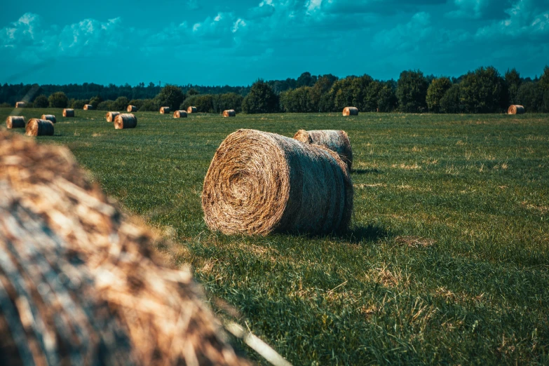 some bales sitting in the middle of a field