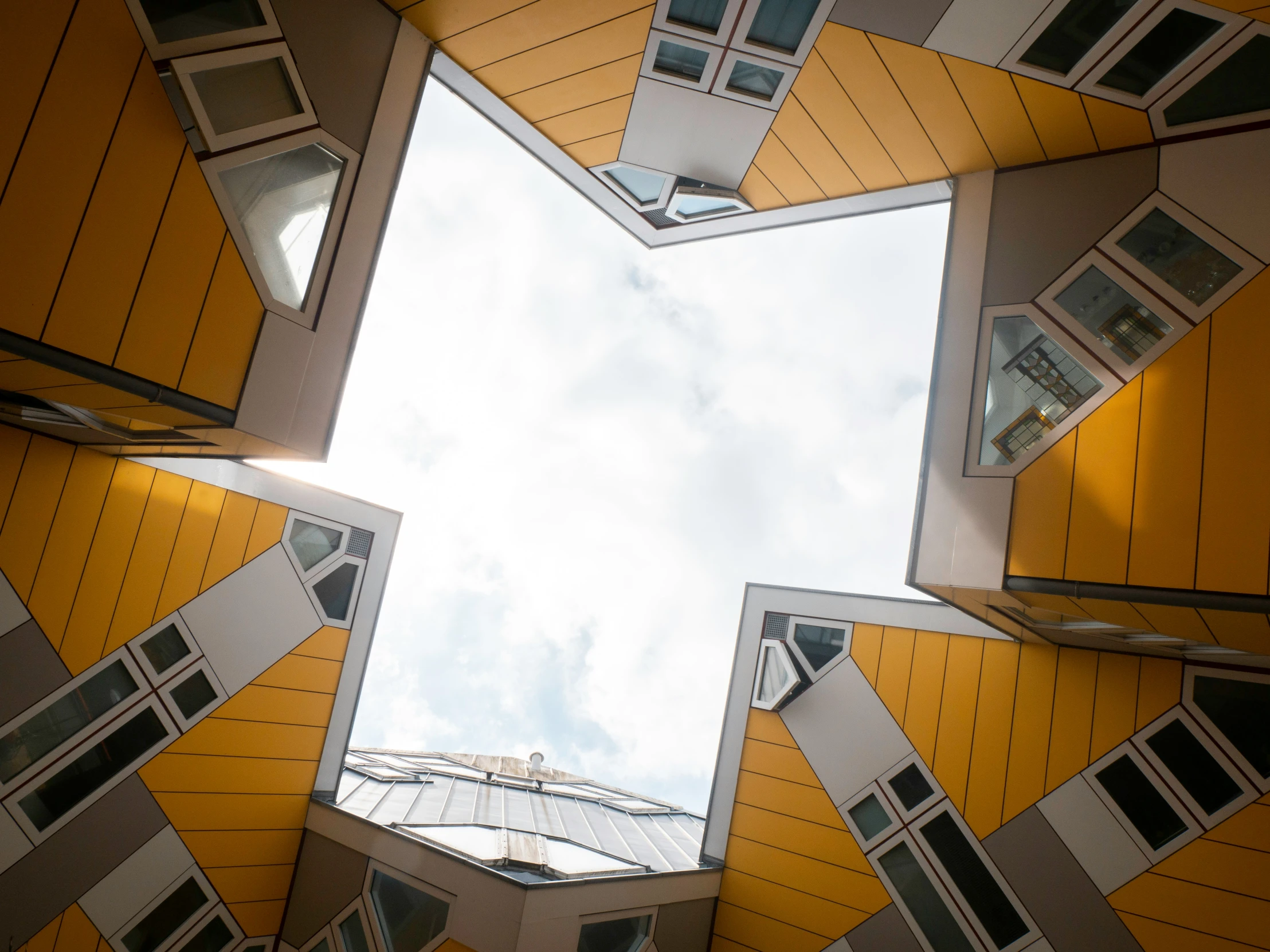 a square that has the top section cut into and a skylight