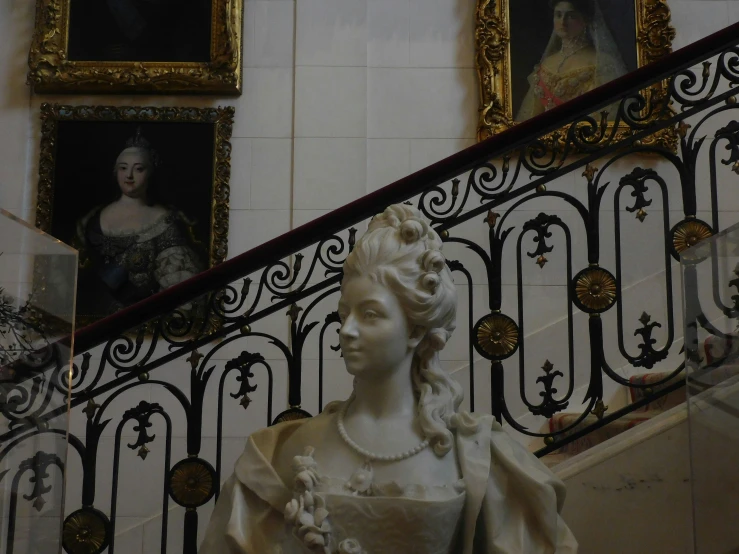 a picture of a painting of a lady on the stair rail