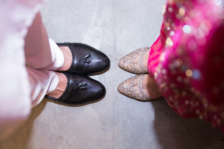 two brides getting ready to go in their wedding shoes