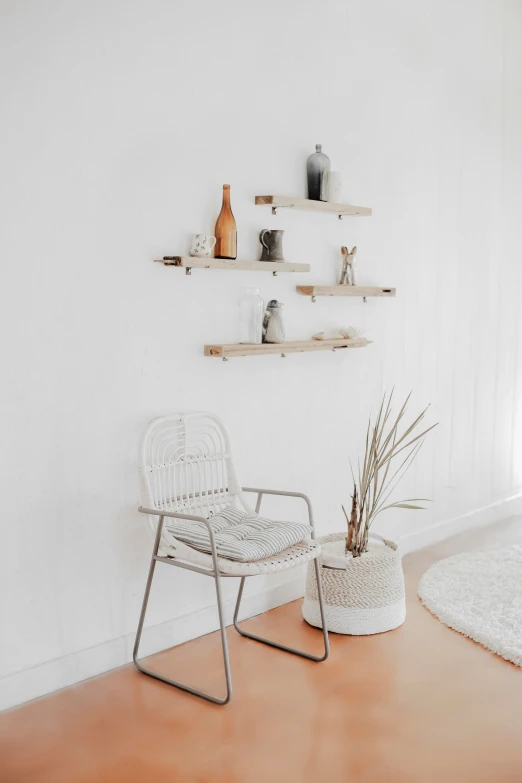 two white chairs and two shelves in a room