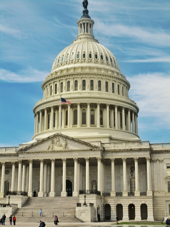 the us capitol building is seen under a cloudy sky