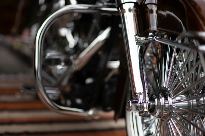 a silver motorcycle with spokes and wheel hubs