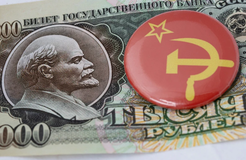 a on on a $ 100 bill with communist symbols