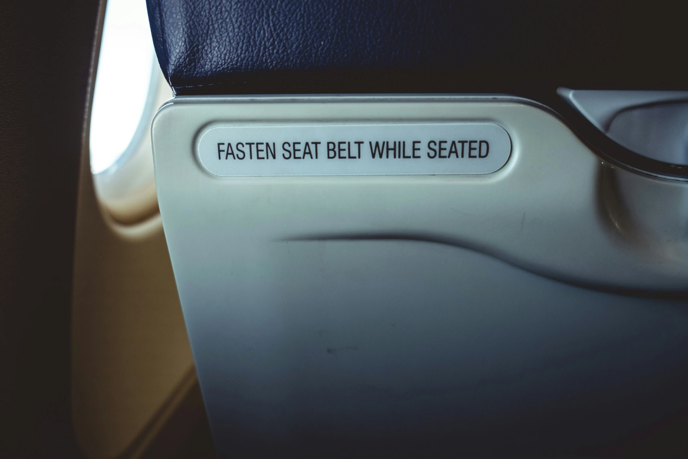 the seat on an airplane is empty of people