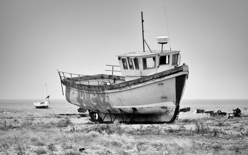 this is an old boat abandoned on the shore