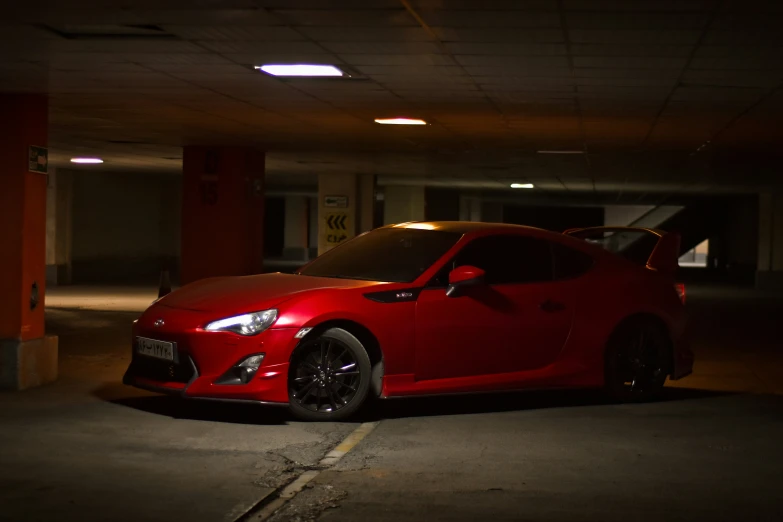 the car is parked in the parking garage at night