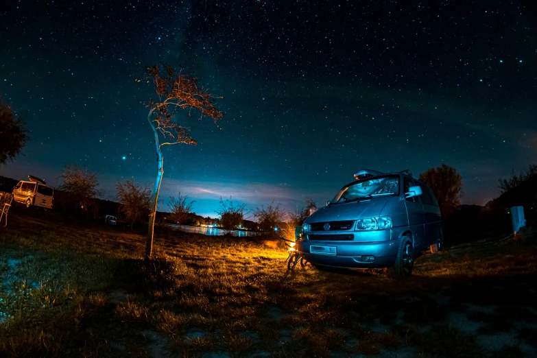 a car that is parked outside under the stars