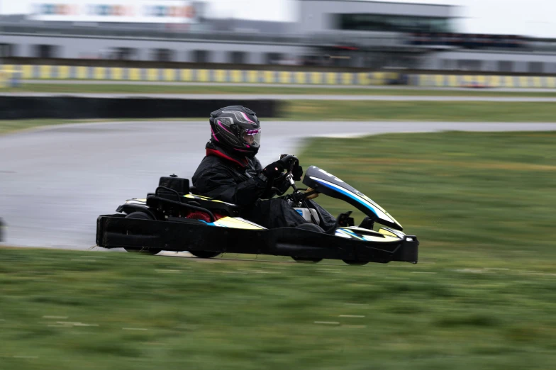 a person riding a go kart on a track