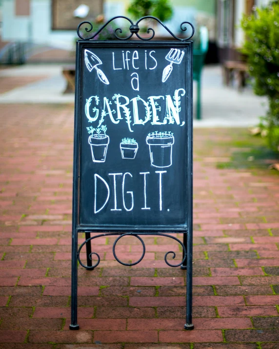 a chalkboard sign in front of a building