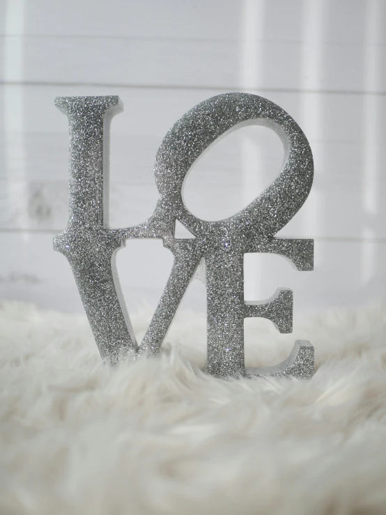 the letters love and f are made from tiny bubbles