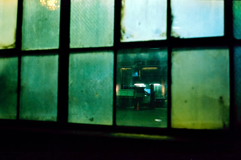 a group of windows that show the street below