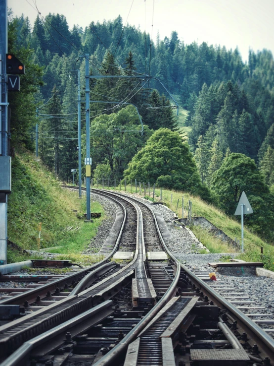 a view from an overpass on a train track