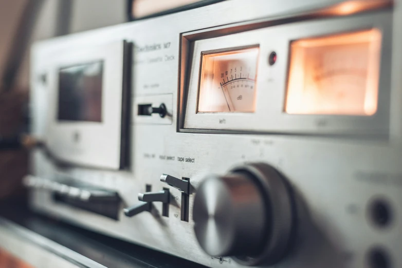 a metallic radio with s and controls on it