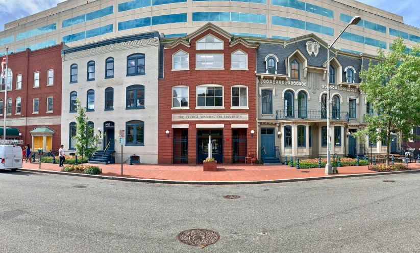 a building that is red in color near the street