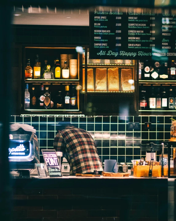 the bar area is filled with alcohol and drinks